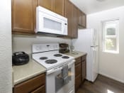 Thumbnail 4 of 34 - White Appliances in Kitchen at Eucalyptus Grove Apartments, Chula Vista, CA, 91910